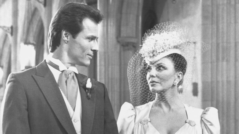 Joan Collins as Alexis Carrington Colby (right) and Michael Nader as Dex Dexter (left) on an episode of "Dynasty"