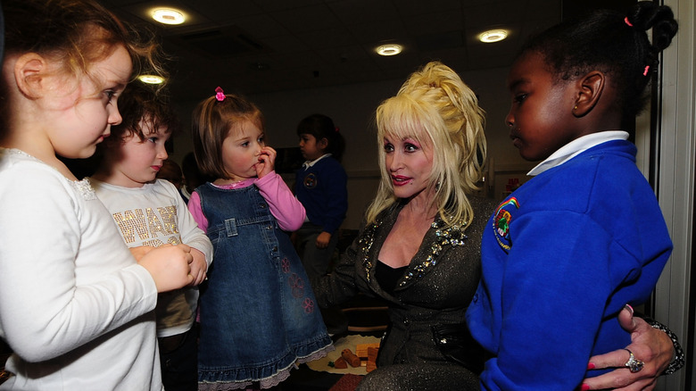 Dolly Parton interacting with children