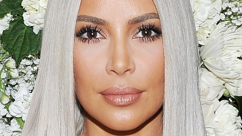 Kim Kardashian poses with silver hair