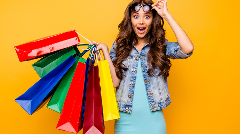 Woman holding colorful shopping bags