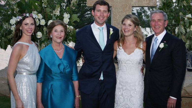 Barbara Bush, Laura Bush, Henry Hager, Laura Bush Hager, and George W. Bush smiling in wedding attire