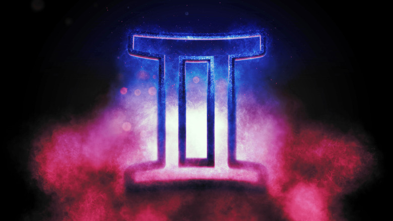 Gemini symbol with blue and pink smoke in the background