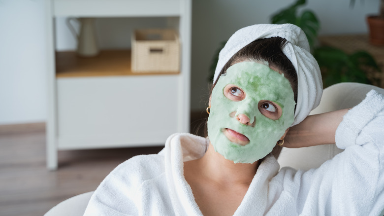 Woman with green bubble mask
