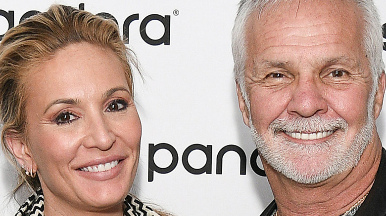 Below Deck stars Kate Chastain and Captain Lee pose together