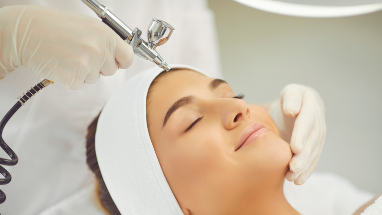 young woman getting oxygen facial