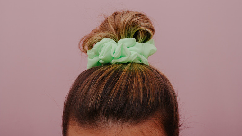 hair tied up with scrunchie