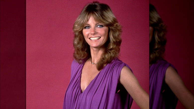 Cheryl Tiegs smiling with a 1980s hairstyle