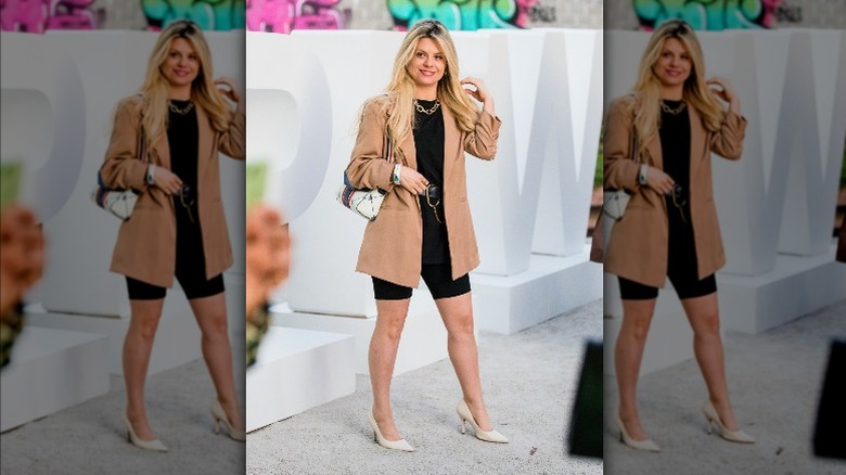Woman wearing biker shorts, blazer