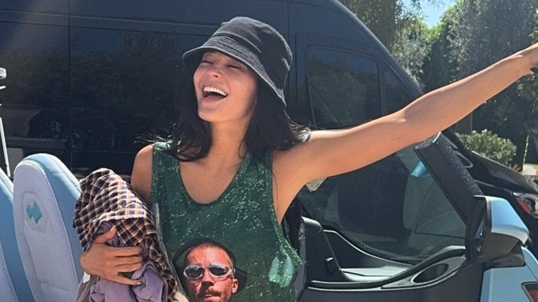 Kylie Jenner smiling and posing for a photograph during Coachella's first weekend