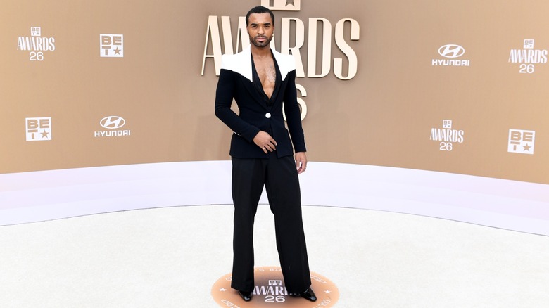 Johnny Geter in a black suit on the 2026 BET Awards red carpet
