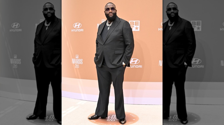 Rick Ross with his hands in his pockets on the red carpet at the 2026 BET Awards