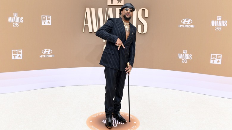 The-Dream resting on his cane on the red carpet of the 2026 BET Awards