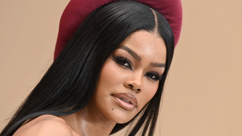 A close-up of Teyana Taylor looking down the barrel of the camera at the 2026 BET Awards