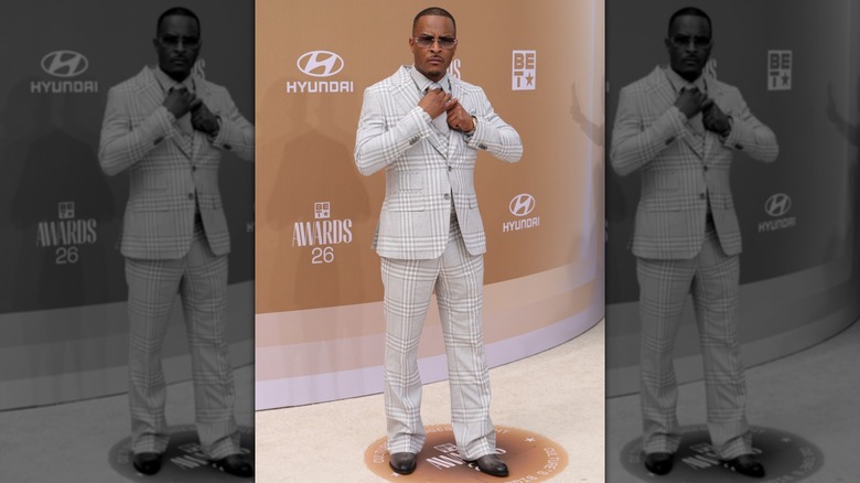 T.I. tightening up his tie on the 2026 BET Awards red carpet