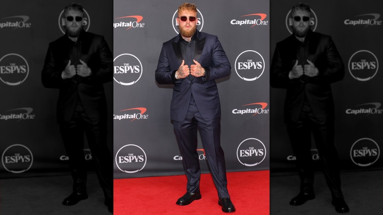 Jake Paul on the ESPYS red carpet in 2026, posing with his hands on his suit lapels
