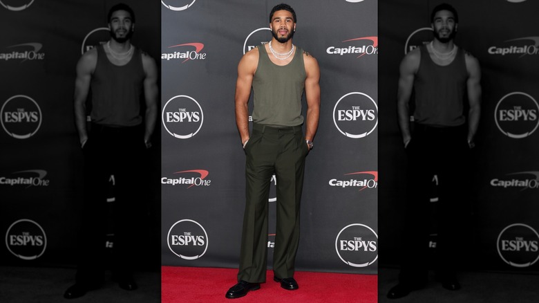 Jayson Tatum in a green vest on the 2026 EPSYs red carpet with his hands in his trouser pockets