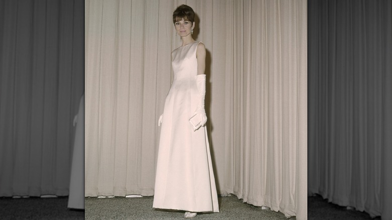 Audrey Hepburn in a flowing pink dress at the 1965 Oscars.