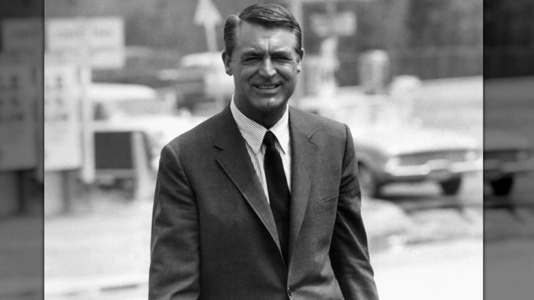 Cary Grant walking through Los Angeles in a suit in 1964.