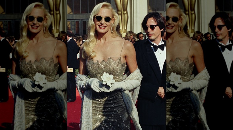 Daryl Hannah attending the 1988 Academy Awards, wearing a gold dress with a shawl and gold/black sunglasses.