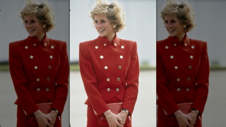 Diana, Princess of Wales in 1989, smiling and wearing a red suit.