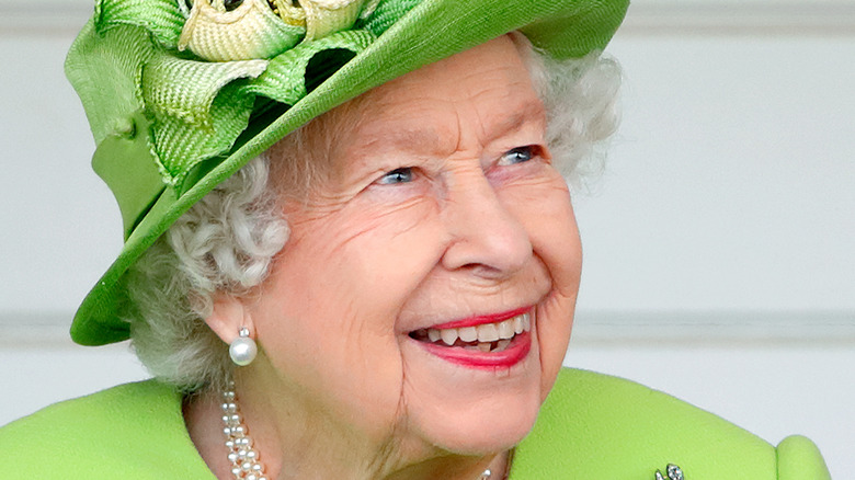 The Queen wearing green hat