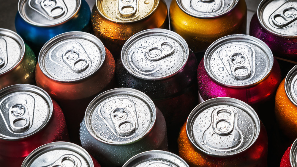 Soda cans wet with condensation