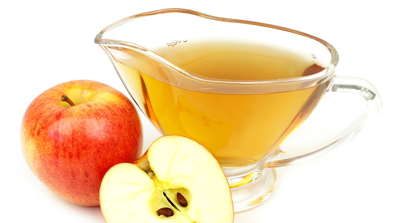 Apple Cider Vinegar with Apples close-up