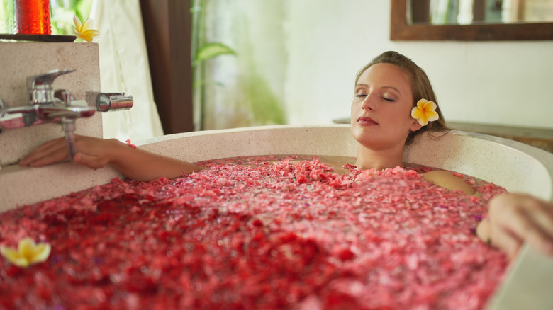 Woman soaking in a bathtub