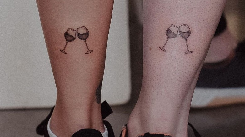Matching wine glasses tattoos