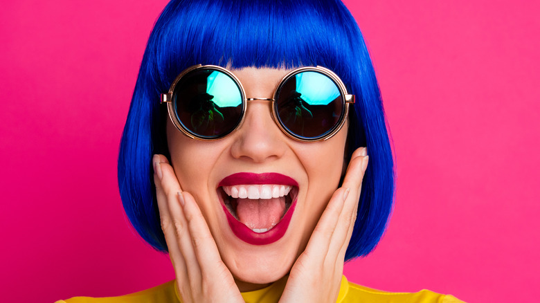 Woman smiling with blue hair