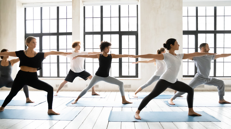 group doing yoga class