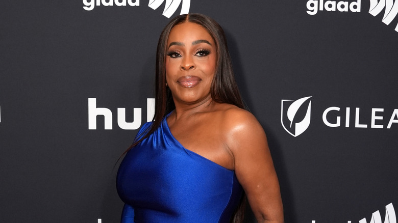 Niecy Nash-Betts walking a red carpet.