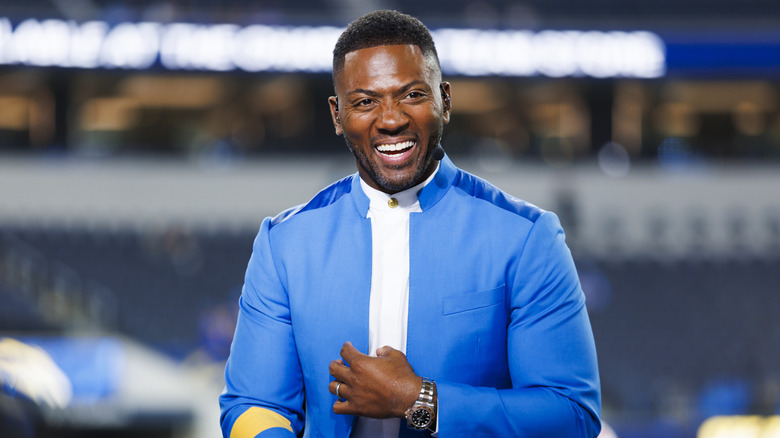 Ryan Clark laughing at a sporting event.