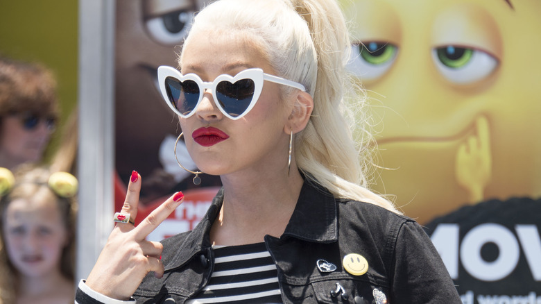 Christina Aguilera heart sunglasses peace sign