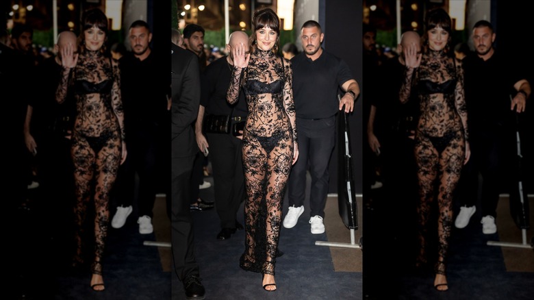 Dakota Johnson smiling and waving at the Kering Foundation's Caring for Women dinner