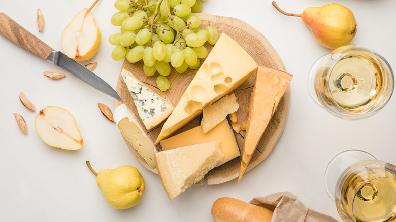 Cheese platter with wine glasses