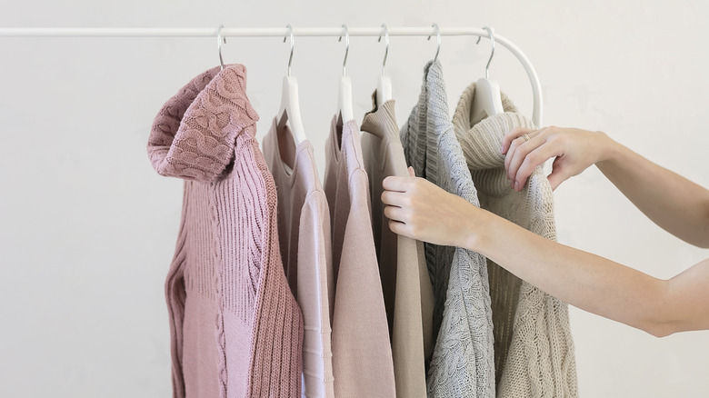 \Woman selecting sweater colors