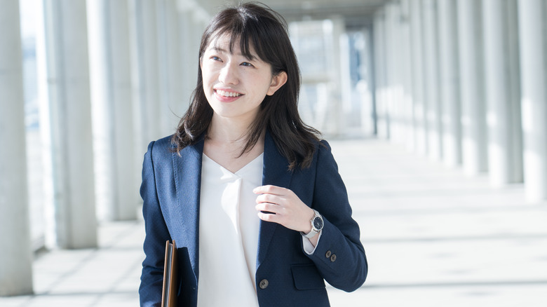 woman in blue pantsuit 
