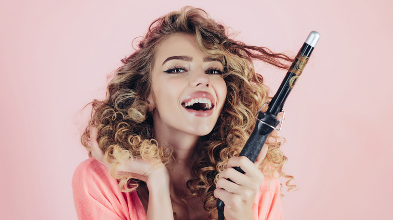 Woman using a curling iron 