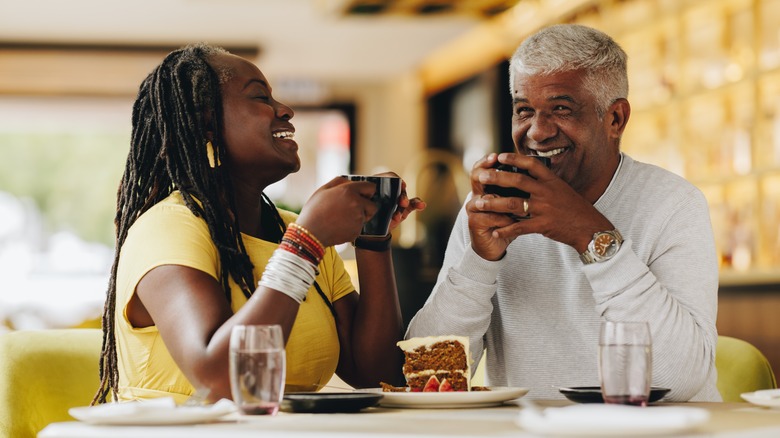 Laughing mature couple on date