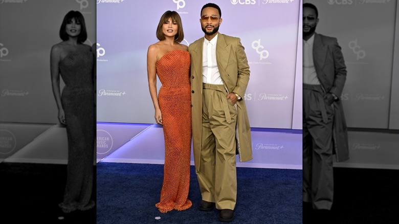 Chrissy Teigen and John Legend arm-in-arm at the 2026 AMAs