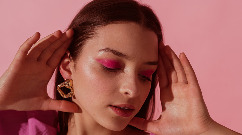 A woman in an all pink look