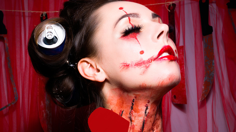 Woman in Halloween costume with fake blood