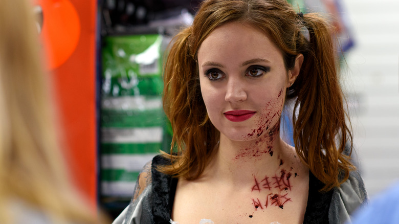 Woman wearing fake blood with her costume