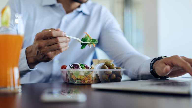 Man eating salad