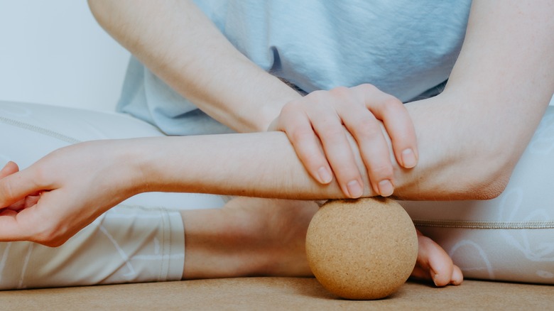 Woman's forearm on foam ball