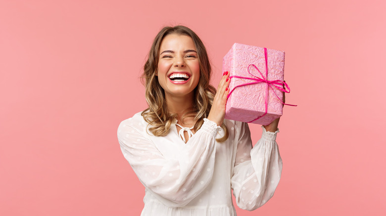 model holding pink gift