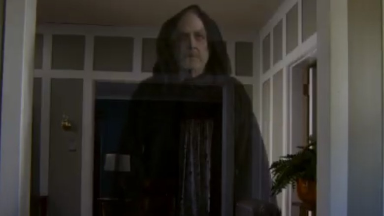 A menacing-looking, translucent man in a black hooded cloak in Hallmark's "Oliver's Ghost"