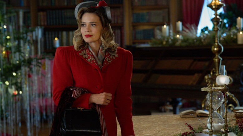 Bethany Joy Lenz wearing a red coat while filming A Biltmore Christmas