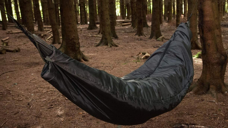 black cocoon hammock in the woods